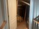 An unfinished attic with exposed beams, insulation, and a water heater at 159 Tara Blvd, Loganville, GA 30052