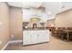 Entertaining bar area with seating, a mini sink, and access to a dining area with a large table at 159 Tara Blvd, Loganville, GA 30052