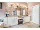 Large bathroom with double vanity, granite counters, and tiled floors at 159 Tara Blvd, Loganville, GA 30052