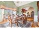 Elegant dining room featuring hardwood floors, chandelier, and bay window at 159 Tara Blvd, Loganville, GA 30052