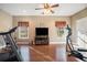 Bright exercise room featuring hardwood floors, fitness equipment, and natural light from the windows at 159 Tara Blvd, Loganville, GA 30052