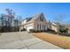 Charming two-story brick home featuring an attached garage, manicured lawn and mature trees at 159 Tara Blvd, Loganville, GA 30052