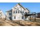 Rear exterior of home showcasing the house's architecture, windows, deck, and outdoor living space at 159 Tara Blvd, Loganville, GA 30052