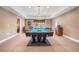 Finished basement game room with pool table, card table, and view to a living area at 159 Tara Blvd, Loganville, GA 30052