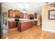 Modern kitchen with granite countertops, stainless steel appliances, and an island with seating at 159 Tara Blvd, Loganville, GA 30052