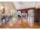 Open-concept living room featuring hardwood floors, fireplace, and large windows offering plenty of natural light at 159 Tara Blvd, Loganville, GA 30052