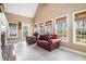 Inviting sun room with fireplace, tiled floor and lots of natural light at 159 Tara Blvd, Loganville, GA 30052