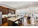 Spacious kitchen featuring an island with seating, modern appliances and hardwood floors at 194 Inman Ne Ln, Atlanta, GA 30307