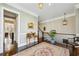 Upstairs landing with wood floors, elegant decor, and natural light streaming in from nearby windows at 194 Inman Ne Ln, Atlanta, GA 30307