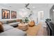 Cozy living room featuring a large sectional couch, unique wall art and view to bathroom at 3543 Cedarvale Ct, Powder Springs, GA 30127