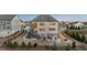 Aerial view of home with multi-level deck, stone patio, fire pit, and landscaped backyard at 4440 Croftshire Pl, Cumming, GA 30040