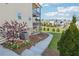 The home features a multilevel deck, a landscaped yard, a rock border and flowering trees at 4440 Croftshire Pl, Cumming, GA 30040