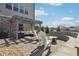 Backyard patio with a pergola, cozy seating, a fire pit, and manicured landscaping at 4440 Croftshire Pl, Cumming, GA 30040