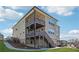 This home has a multi-story deck, brick accents, and a beautifully landscaped backyard at 4440 Croftshire Pl, Cumming, GA 30040