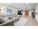 Finished basement area features a large sectional sofa, with access to a bar and barn doors at 4440 Croftshire Pl, Cumming, GA 30040