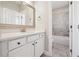 Well-lit bathroom features quartz countertops, updated fixtures, and a tub/shower combo at 4440 Croftshire Pl, Cumming, GA 30040