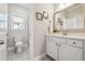 Updated bathroom boasts quartz countertops, modern fixtures, and stylish tile flooring at 4440 Croftshire Pl, Cumming, GA 30040