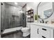 This bathroom has a large walk-in shower, white vanity and black fixtures at 4440 Croftshire Pl, Cumming, GA 30040