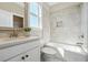 Clean bathroom with a shower and tub, white vanity with quartz countertop, and white subway tile surround at 4440 Croftshire Pl, Cumming, GA 30040
