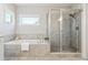 Bathroom with a tile shower and separate tub, and a neutral color scheme for a relaxing spa-like experience at 4440 Croftshire Pl, Cumming, GA 30040