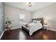 Inviting bedroom with hardwood floors, stylish decor, and ample natural light at 4440 Croftshire Pl, Cumming, GA 30040