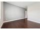 Empty bedroom featuring hardwood flooring and an abundance of natural light at 4440 Croftshire Pl, Cumming, GA 30040