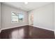 Spacious bedroom with hardwood floors and plenty of natural light from a large window at 4440 Croftshire Pl, Cumming, GA 30040