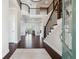 Grand foyer with hardwood floors, staircase, and a view into the living spaces at 4440 Croftshire Pl, Cumming, GA 30040