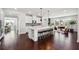 Open kitchen with island, bar seating, stainless steel appliances and modern finishes at 4440 Croftshire Pl, Cumming, GA 30040