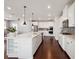 Bright kitchen with large island, stainless steel appliances, and sleek design at 4440 Croftshire Pl, Cumming, GA 30040