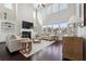 Bright living room with fireplace, high ceilings and many windows offering an abundance of natural light at 4440 Croftshire Pl, Cumming, GA 30040