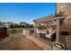 An outdoor patio featuring a pergola, comfortable seating area, and landscaping for a relaxing outdoor experience at 4440 Croftshire Pl, Cumming, GA 30040