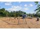 Community playground featuring swings, slides, and other play structures for children at 4440 Croftshire Pl, Cumming, GA 30040