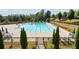 A beautiful outdoor community pool with plenty of seating for relaxation and socializing at 4440 Croftshire Pl, Cumming, GA 30040