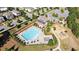 Aerial view of a sparkling pool and playground within a lovely residential community at 4440 Croftshire Pl, Cumming, GA 30040