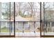 View from sliding glass doors onto balcony with seating and view of neighborhood at 455 Glen Iris Ne Dr # D, Atlanta, GA 30308