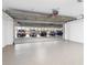 Spacious garage with a high ceiling, epoxy floor, and ample parking space for multiple cars at 455 Glen Iris Ne Dr # D, Atlanta, GA 30308