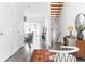 Bright hallway with polished floors, a wooden staircase, and stylish decor at 455 Glen Iris Ne Dr # D, Atlanta, GA 30308