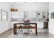Bright kitchen featuring white cabinetry, stainless steel appliances, and a wooden island with bar seating at 455 Glen Iris Ne Dr # D, Atlanta, GA 30308