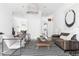 Spacious living room with stylish furniture, polished concrete floors, and bright white walls at 455 Glen Iris Ne Dr # D, Atlanta, GA 30308