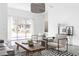 Bright living room boasts large windows, modern furniture, and a stylish striped rug at 455 Glen Iris Ne Dr # D, Atlanta, GA 30308