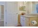 Cozy bathroom featuring light-colored vanity with granite top and ample lighting at 1050 Wedgewood Ln, Tucker, GA 30084