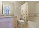 Bathroom with vanity, toilet, and tiled shower/tub combination at 1050 Wedgewood Ln, Tucker, GA 30084