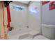 Bright bathroom featuring a tiled tub/shower and a garden window for natural light at 1050 Wedgewood Ln, Tucker, GA 30084