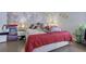 Bedroom featuring a brick wall, vaulted ceiling, and hardwood floors at 1050 Wedgewood Ln, Tucker, GA 30084