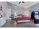 Bright bedroom featuring a brick wall, vaulted ceiling, and hardwood floors at 1050 Wedgewood Ln, Tucker, GA 30084