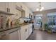 Modern kitchen featuring white cabinets, stainless steel appliances, and natural light at 1050 Wedgewood Ln, Tucker, GA 30084