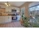 Charming kitchen featuring white cabinets, stainless appliances, and natural light at 1050 Wedgewood Ln, Tucker, GA 30084