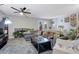 Well-lit living area features a comfortable couch, fireplace, and view of the open floor plan at 1050 Wedgewood Ln, Tucker, GA 30084