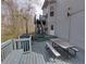 A spacious back deck with picnic tables is connected to the house by stairs from an upper deck at 1413 Eastbrooke Way, Marietta, GA 30066